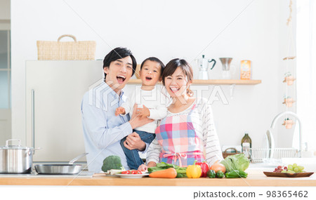 A young family in the kitchen 98365462