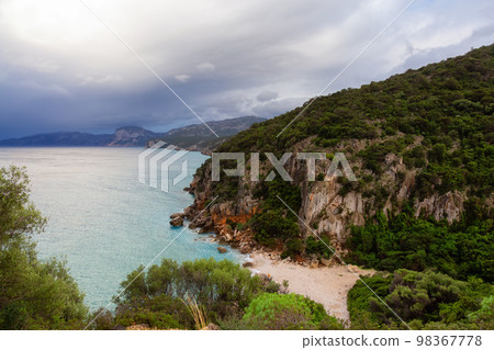 Sandy Beach on a rocky coast near Cala Gonone, Sardinia. Sandy Beach on a rocky coast near Cala Gonone, Sardinia. 98367778