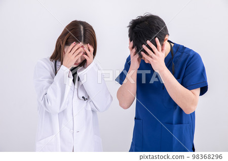 A doctor holding his head Doctor 98368296