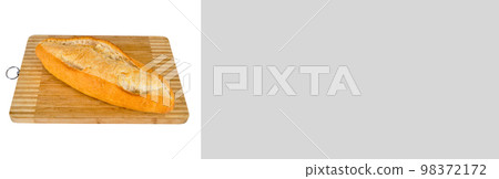 Fresh nutritious and golden colored bread, on a bamboo cutting board, banner mock up poster desing Fresh nutritious and golden colored bread, on a bamboo cutting board, banner mock up poster desing 98372172