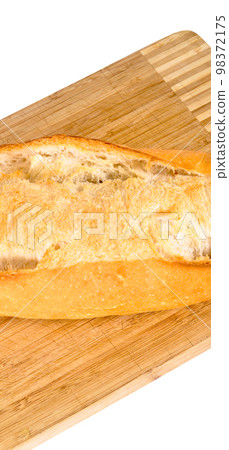 Fresh nutritious and golden colored bread, on a bamboo cutting board Fresh nutritious and golden colored bread, on a bamboo cutting board 98372175