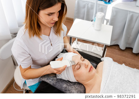 Cropped shot of a woman getting ultrasound cavitation treatment Cropped shot of a woman getting ultrasound cavitation treatment 98372291