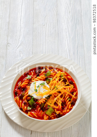 Black Bean Soup with spiral pasta and vegetables Black Bean Soup with spiral pasta and vegetables 98372518