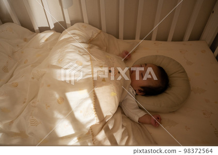 A baby sleeping in Nentre at night A baby sleeping in Nentre at night 98372564