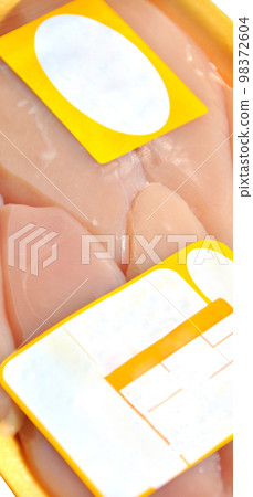 Fresh uncooked chicken breast meat pieces, packed and ready to cook Fresh uncooked chicken breast meat pieces, packed and ready to cook 98372604