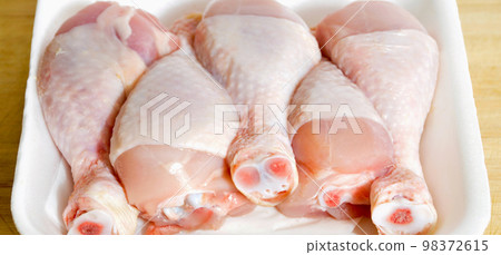 Fresh uncooked chicken meat drumsticks pieces, in package baget ready to cook 98372615