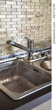 Interior of modern kitchen and stainless steel sink, tap and drain Interior of modern kitchen and stainless steel sink, tap and drain 98373299