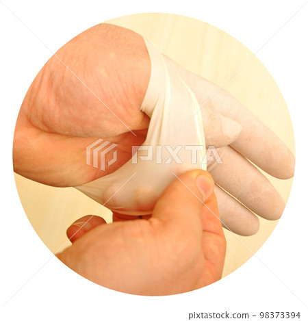 Male doctor hand in white surgical glove, medical latex glove 98373394