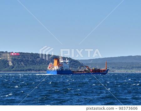 Cargo ship crossing Canakkale strait 98373606