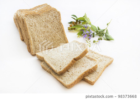 slice of bread bakery dessert with flowers arrangement flat lay style slice of bread bakery dessert with flowers arrangement flat lay style 98373668