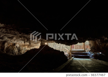 Old stone bat cave in the rock. Tourist attraction. Walk in the cave. Old stone bat cave in the rock. Tourist attraction. Walk in the cave. 98377467