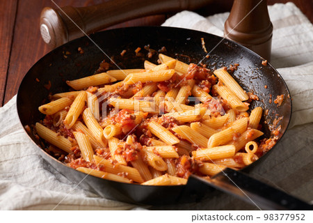 Penne bolognese cooked in a skillet Penne bolognese cooked in a skillet 98377952