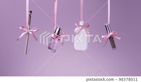 St. Valentines Day gifts. Shopping and sales concept. makeup brush, lip stick and perfumes on trendy pink pastel background with copy space for your design. St. Valentines Day gifts. Shopping and sales concept. makeup brush, lip stick and perfumes on trendy pink pastel background with copy space for your design. 98378011