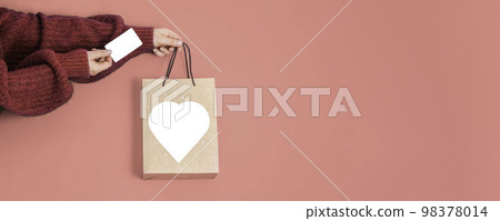 Valentine's Day Composition: craft gift bag with isolated copyspace, credit gift card 98378014