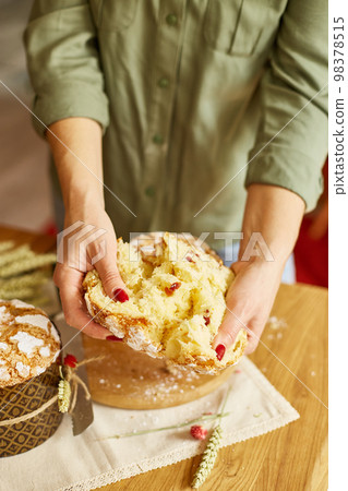 Happy Easter, Woman cut Easter cake for the holiday Happy Easter, Woman cut Easter cake for the holiday 98378515
