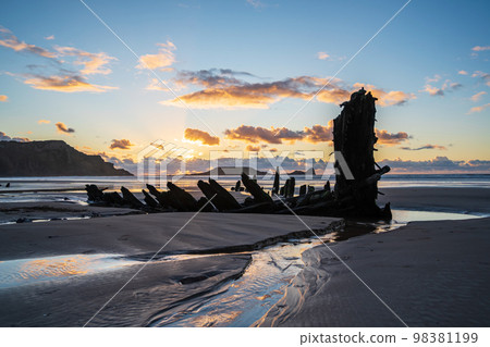 Wreck of Helvetia at sunset, Rhossili Bay beach, no people. Gower Peninsula, South Wales, the United Kingdom, UK GB. 98381199