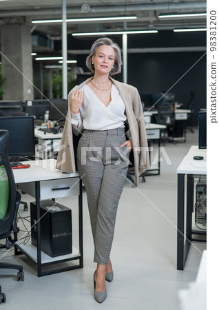 Portrait of an attractive mature caucasian woman in the office.  98381200