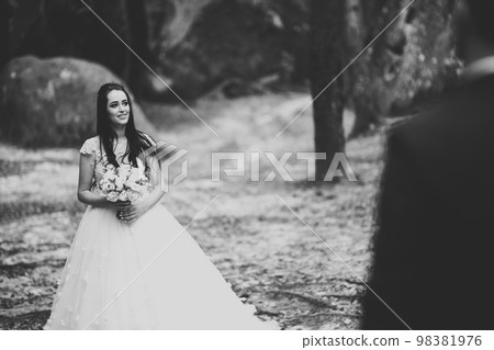 Bride holding big and beautiful wedding bouquet with flowers 98381976