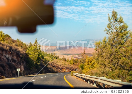 Driving a car on a mountain road in northern Israel 98382566