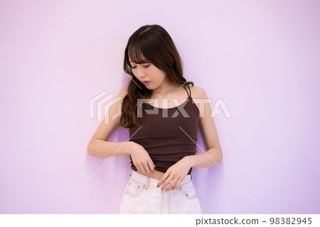 Young lady with tank top Young lady with tank top 98382945