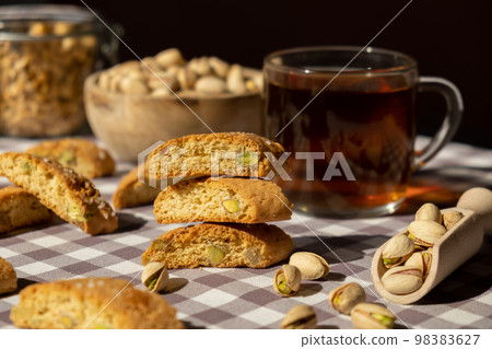 Biscotti Cantuccini Cookie Biscuits with pistachios and lemon peel Shortbread. Cup of tea. Teatime break Healthy eating food. Homemade fresh Italian cookies cantucci stacks and organic pistachios Biscotti Cantuccini Cookie Biscuits with pistachios and lemon peel Shortbread. Cup of tea. Teatime break Healthy eating food. Homemade fresh Italian cookies cantucci stacks and organic pistachios 98383627