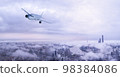 飛機在雲層之上飛行 98384086