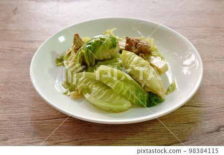 fried Brussels sprout with slice pork in oyster sauce on plate  98384115