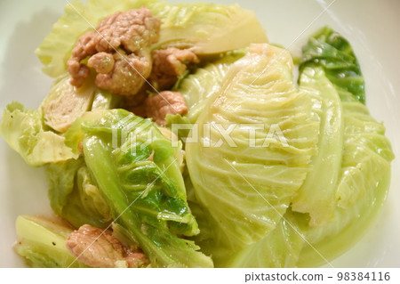 fried Brussels sprout with slice pork in oyster sauce on plate  98384116