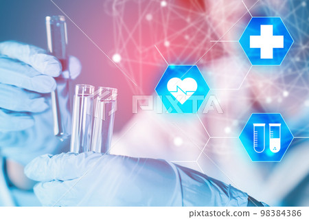 Healthcare and science technology. Scientist hand hold test tubes filled with blue sample chemicals in chemistry, biology, biotechnology laboratory. Innovation medicine, medical research. Glassware. 98384386