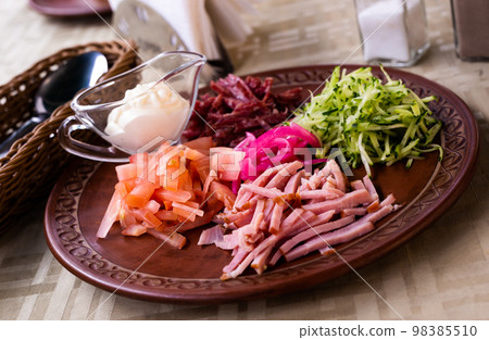 traditional Belarusian salad of vegetables and bacon. salad Paparats kvetka traditional Belarusian salad of vegetables and bacon. salad Paparats kvetka 98385510