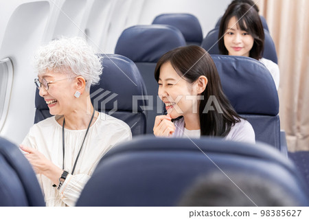 Passengers traveling by plane 98385627