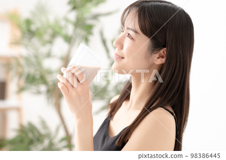 Woman with protein exercise diet 98386445