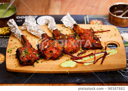 Grilled Lamb Lollipop Chops With Green Goddess Dipping Sauce Grilled Lamb Lollipop Chops With Green Goddess Dipping Sauce 98387882