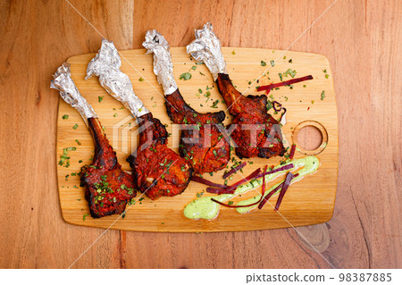 Grilled Lamb Lollipop Chops With Green Goddess Dipping Sauce 98387885