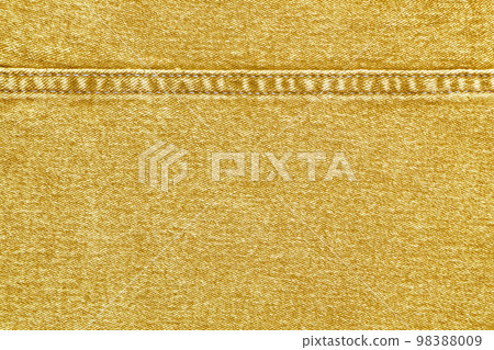 Yellow denim jeans with a seam texture background 98388009