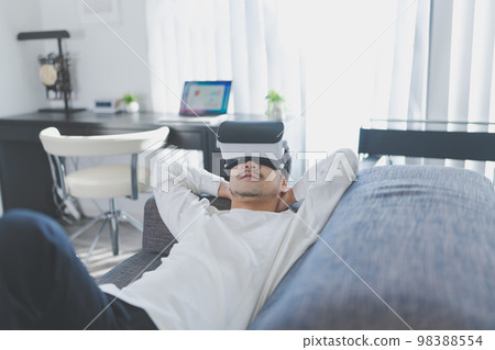 Man enjoying VR content Man enjoying VR content 98388554