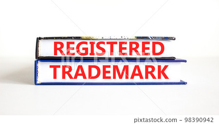 Registered trademark symbol. Concept word Registered trademark on books. Beautiful white table white background. Business and registered trademark concept. Copy space. 98390942
