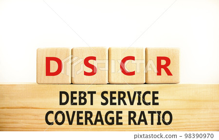 DSCR debt service coverage ratio symbol. Concept words DSCR debt service coverage ratio on wooden block on beautiful white background. Business DSCR debt service coverage ratio concept. Copy space. DSCR debt service coverage ratio symbol. Concept words DSCR debt service coverage ratio on wooden block on beautiful white background. Business DSCR debt service coverage ratio concept. Copy space. 98390970