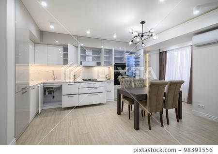 White modern new well designed white kitchen in studio flat interior White modern new well designed white kitchen in studio flat interior 98391556