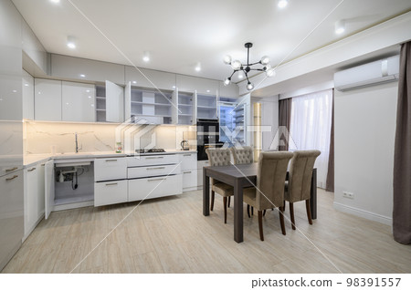White modern new well designed white kitchen in studio flat interior White modern new well designed white kitchen in studio flat interior 98391557