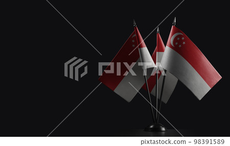 Small national flags of the Singapore on a black background Small national flags of the Singapore on a black background 98391589