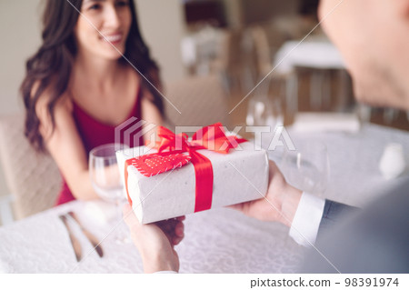 Valentine's Day concept. Happy couple in love. Couple celebrating Valentine's Day in restaurant. Valentine's Day concept. Happy couple in love. Couple celebrating Valentine's Day in restaurant. 98391974