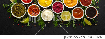 Sauces in bowls with seasonings 98392697