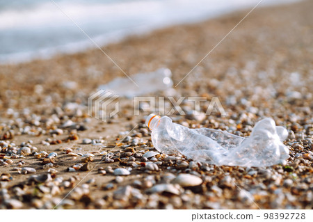 Empty plastic bottles on the beach,. Trash on the beach. Seashore and water pollution concept. Empty plastic bottles on the beach,. Trash on the beach. Seashore and water pollution concept. 98392728