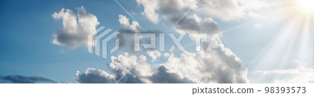 Bright clouds in the evening sky Bright clouds in the evening sky 98393573
