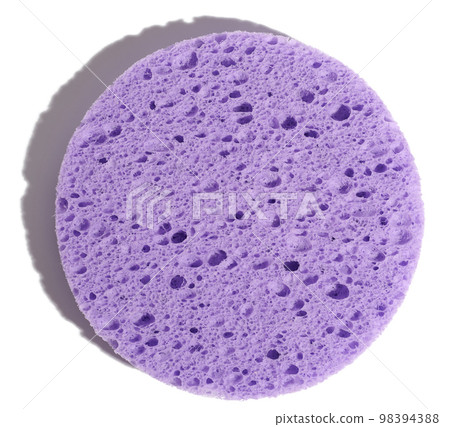 Round purple makeup sponge on a white isolated background, top view 98394388