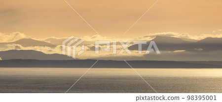 Vancouver Island Covered in Clouds during winter sunset. Vancouver Island Covered in Clouds during winter sunset. 98395001