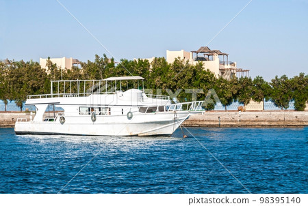 Boat at the pier in the Red Sea in Egypt, Africa 98395140