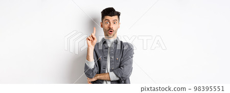 Excited bearded guy pitching an idea, raising finger up in eureka gesture and say suggestion, have a plan, standing on white background 98395551
