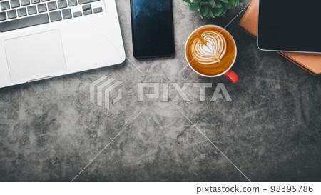 Office desk worplace with laptop computer, tablet, smartphone, notebook and cup of coffee, Top view flat lay with copy space. Office desk worplace with laptop computer, tablet, smartphone, notebook and cup of coffee, Top view flat lay with copy space. 98395786